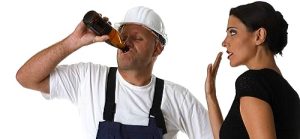 woman tries to stop a worker from drinking alcohol